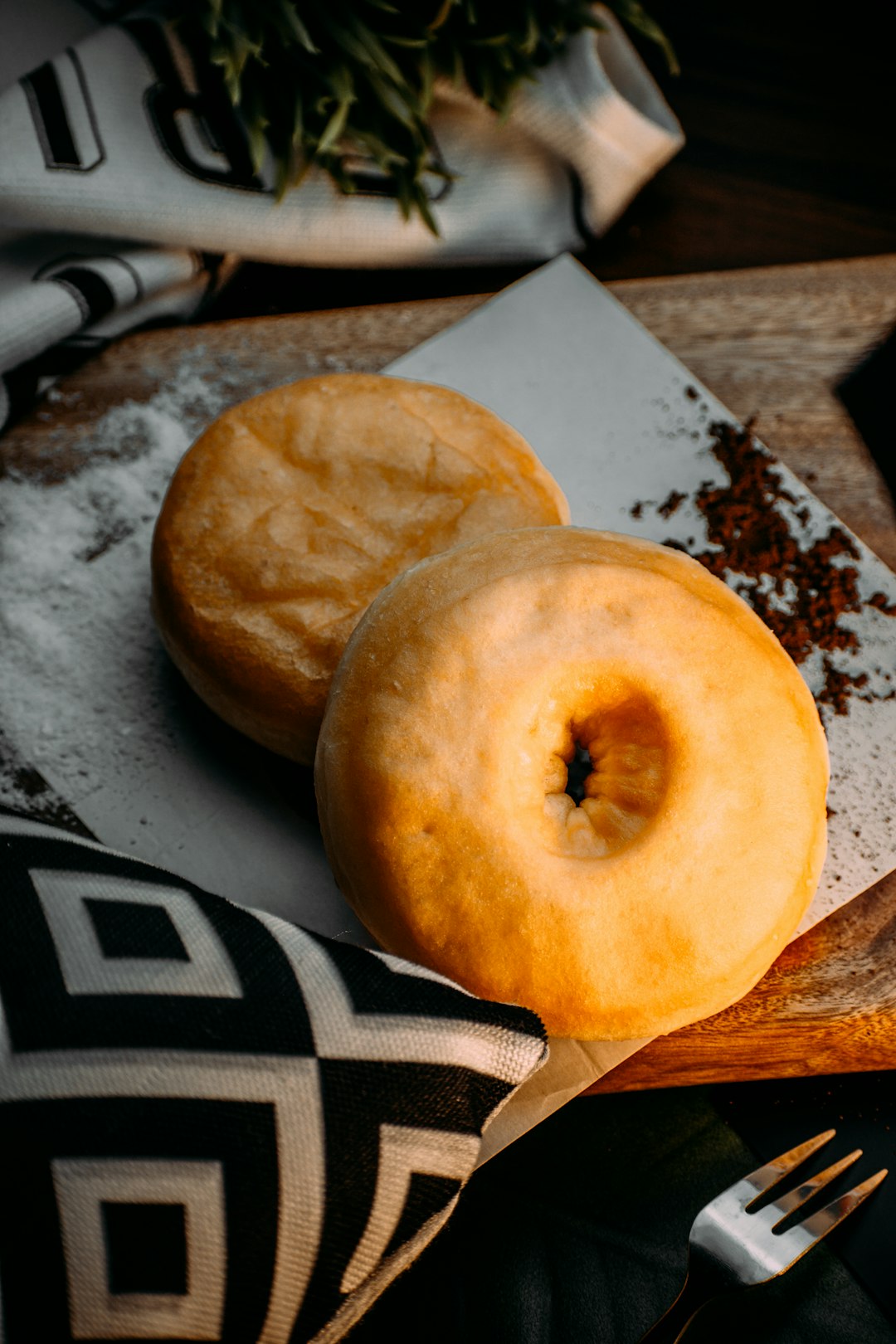 brown round bread on white and black textile