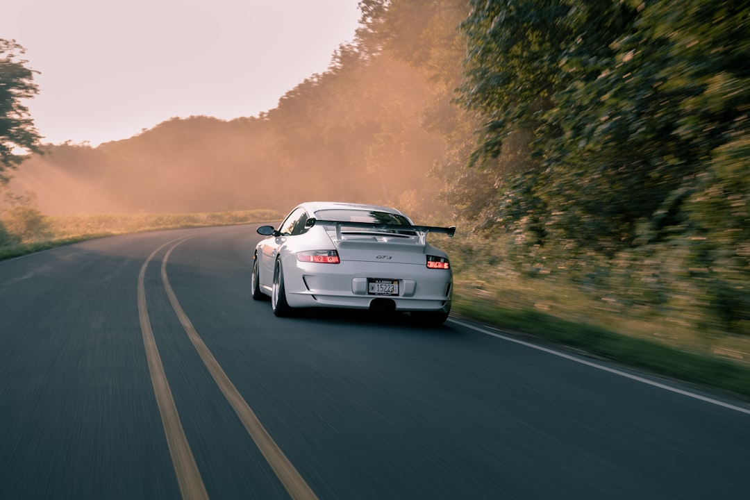 white porsche 911 on road during daytime