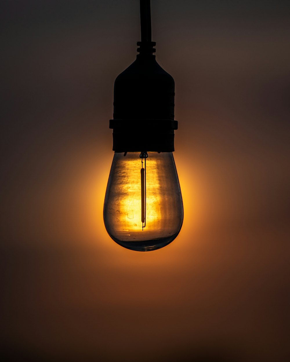 black and yellow light bulb