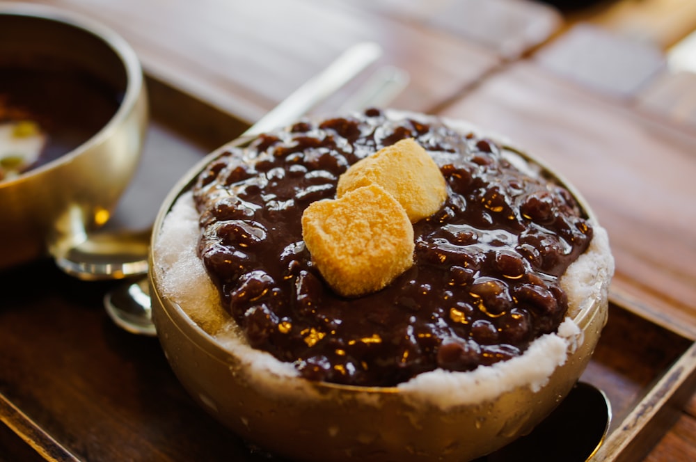 brown and white chocolate cake on white ceramic plate