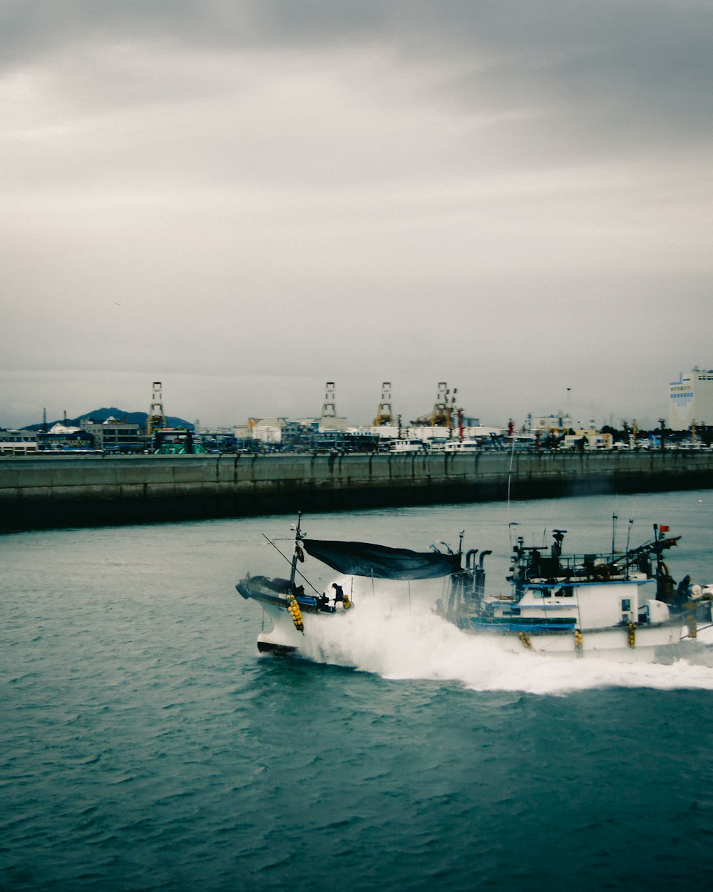 white and black speedboat on sea during daytime