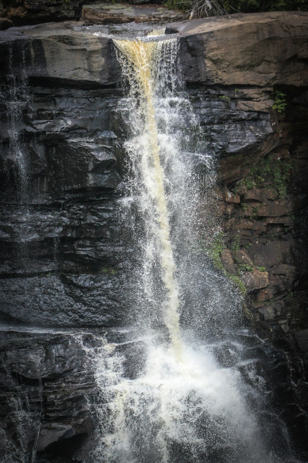 water falls on rocky mountain