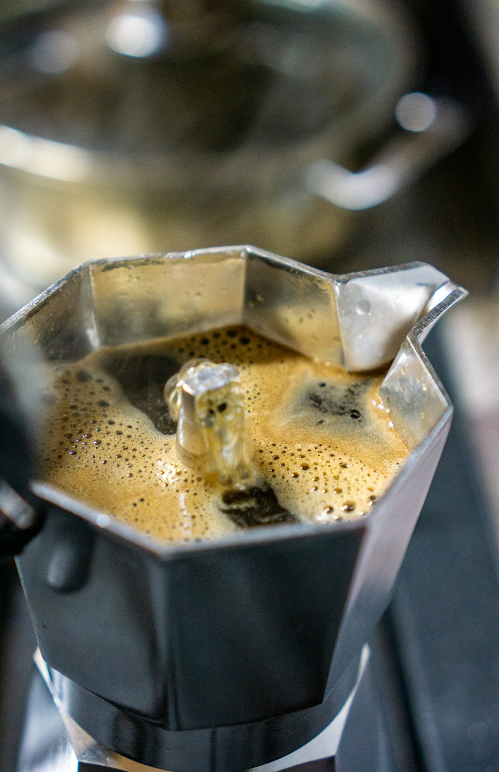 coffee in silver and black coffee pot