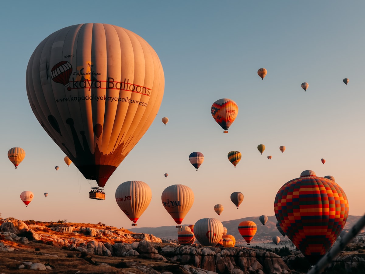 Hot air balloons over Cappadocia landscape