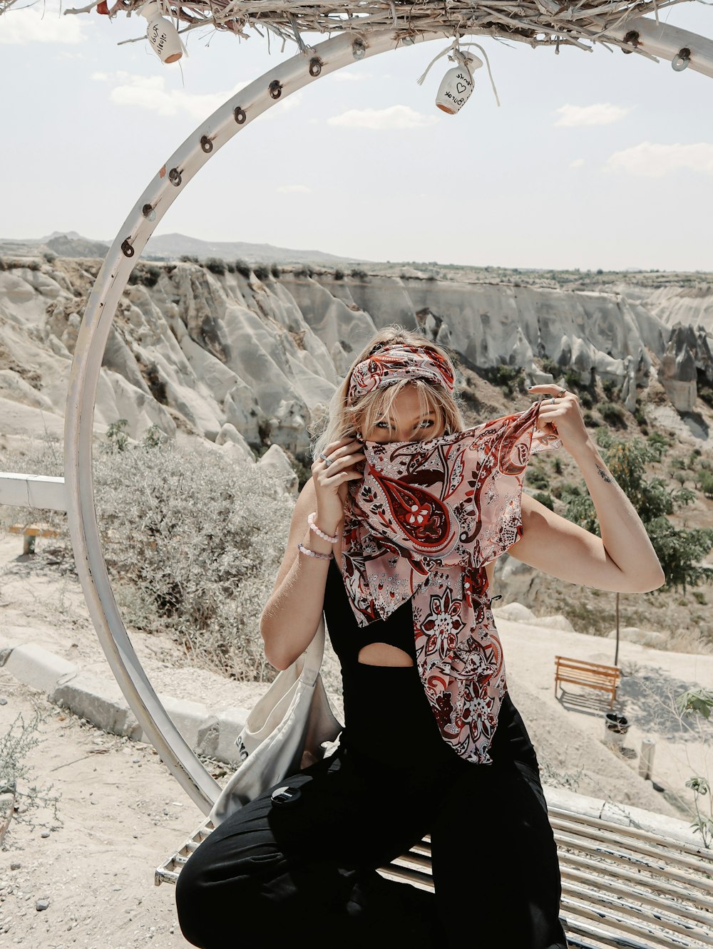 woman in black and red floral sleeveless dress