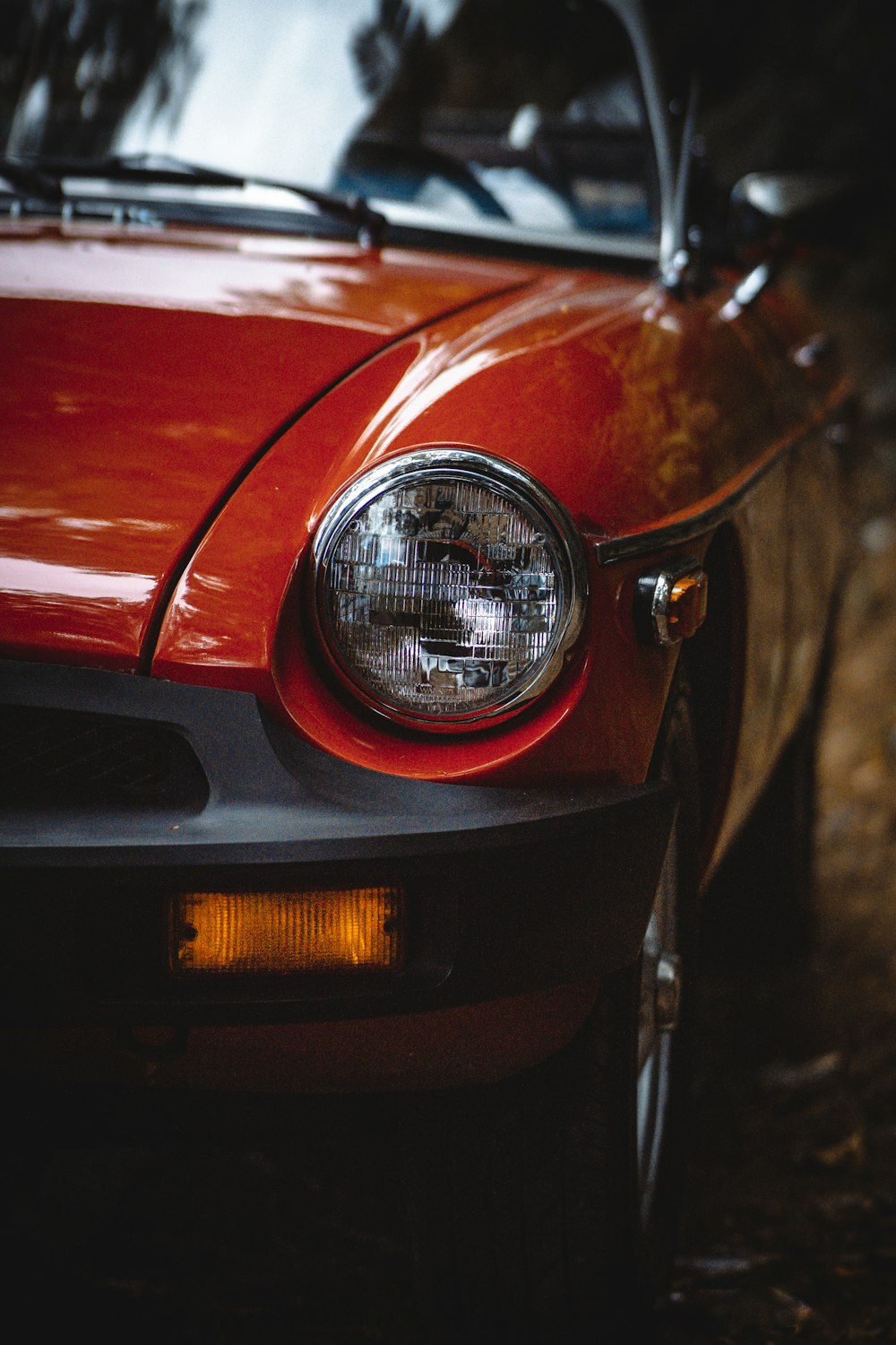 red car with black and silver headlight