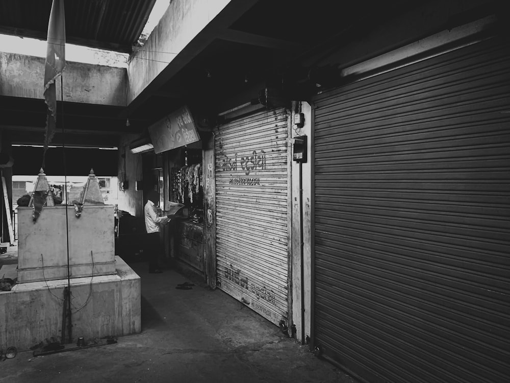 grayscale photo of garage door