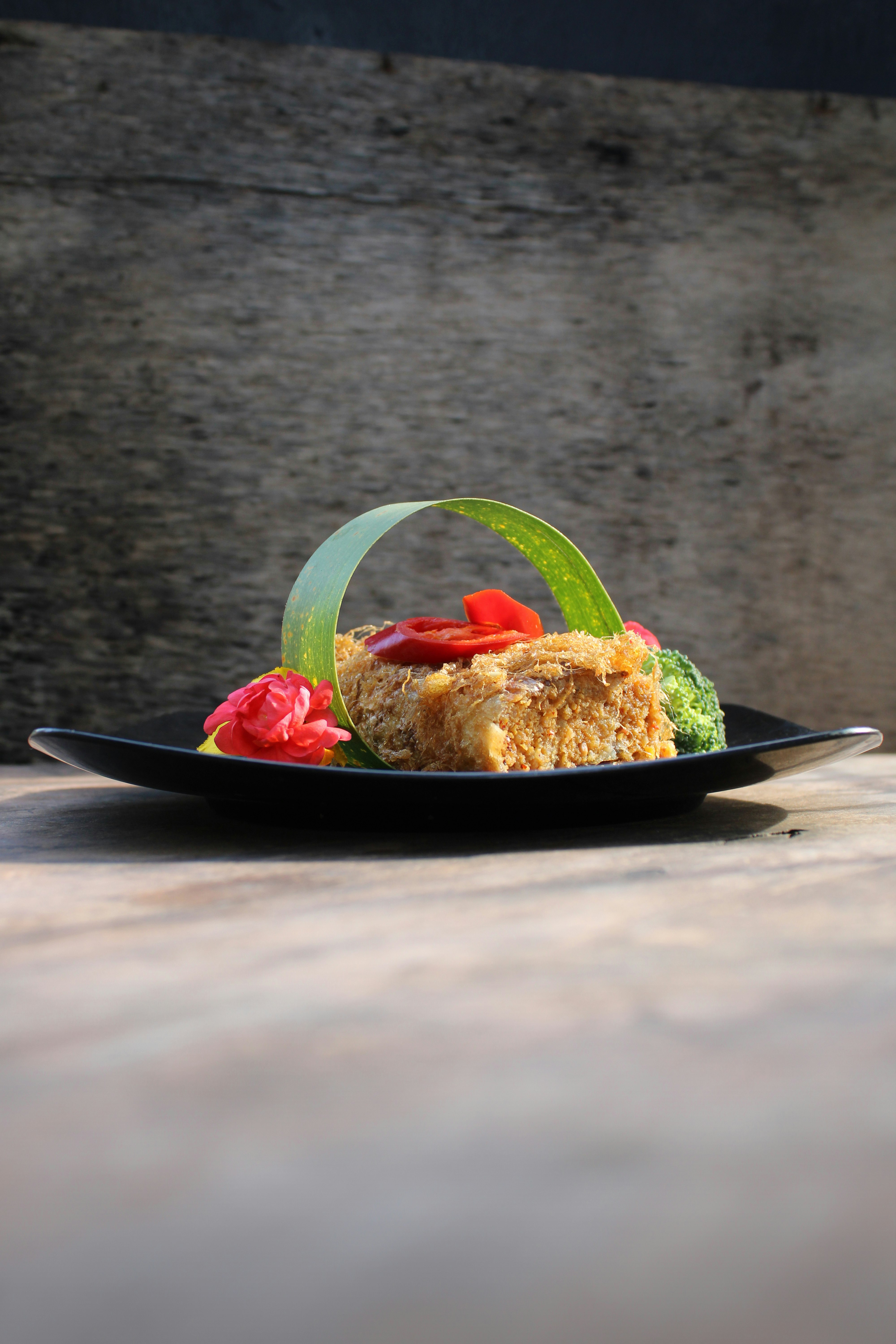 cooked food on black ceramic plate