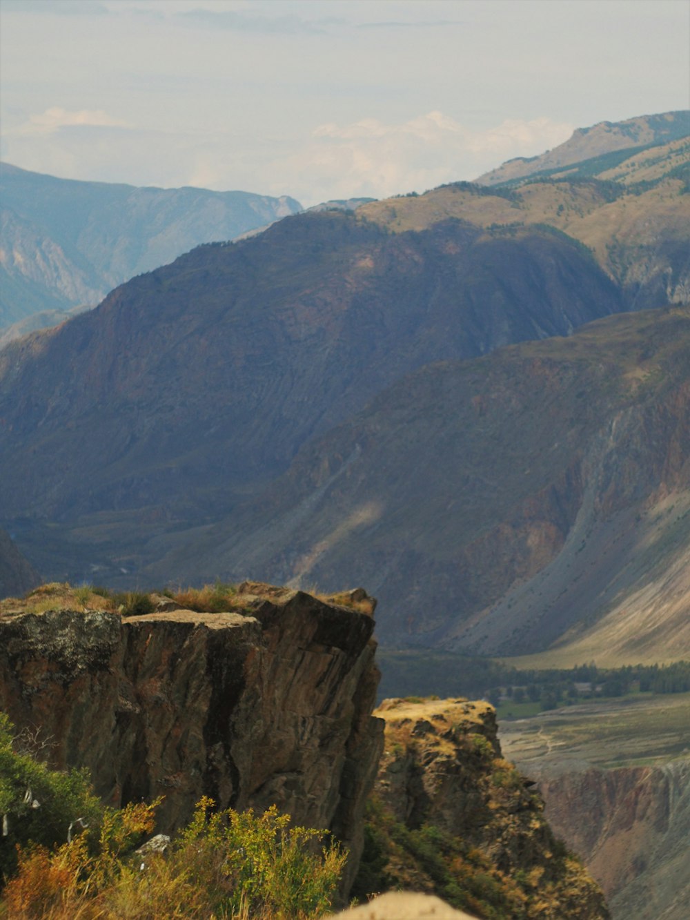 brown rocky mountain under blue sky during daytime