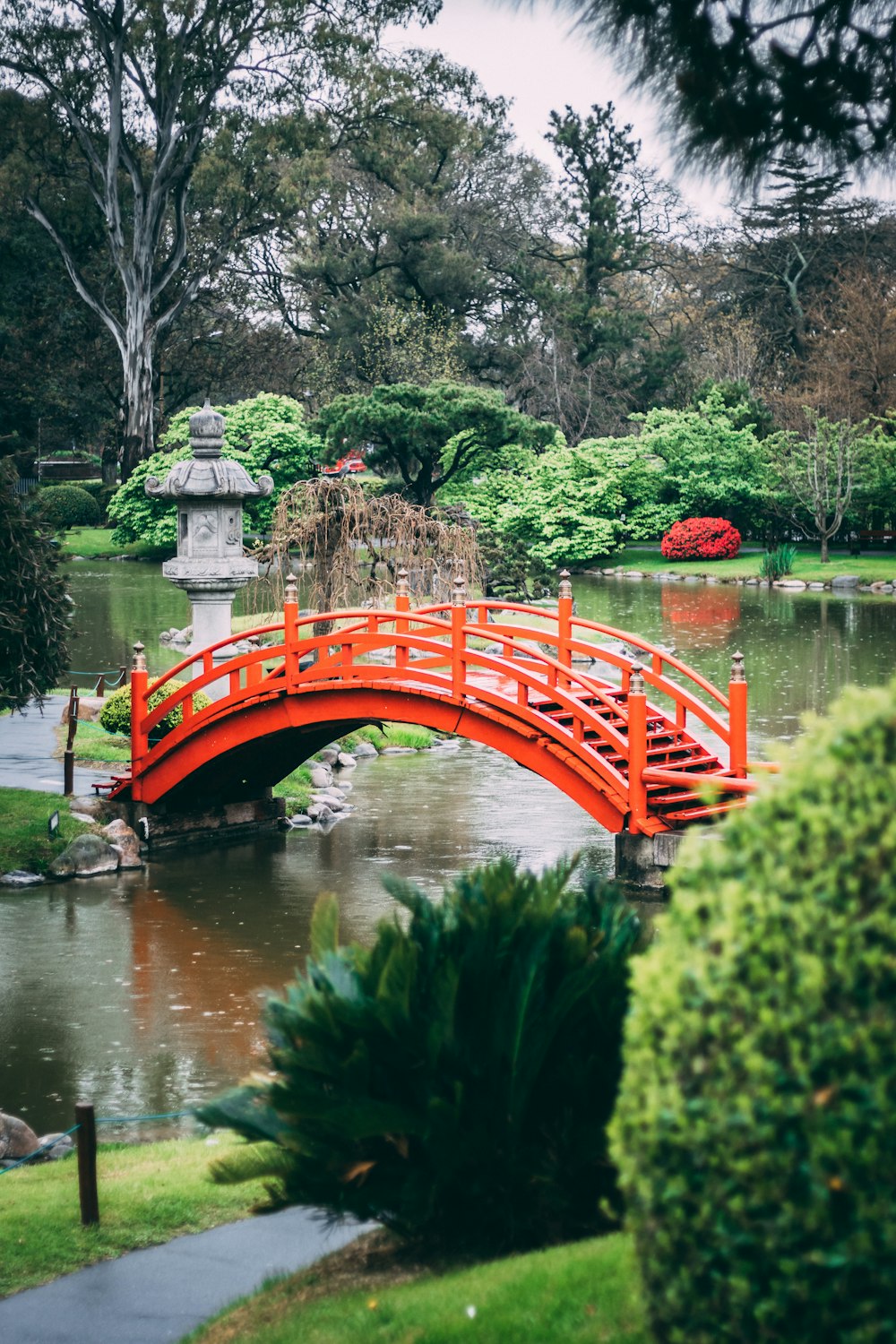 red bridge over river during daytime