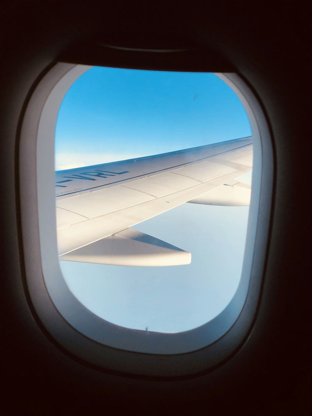 airplane window view of airplane wing