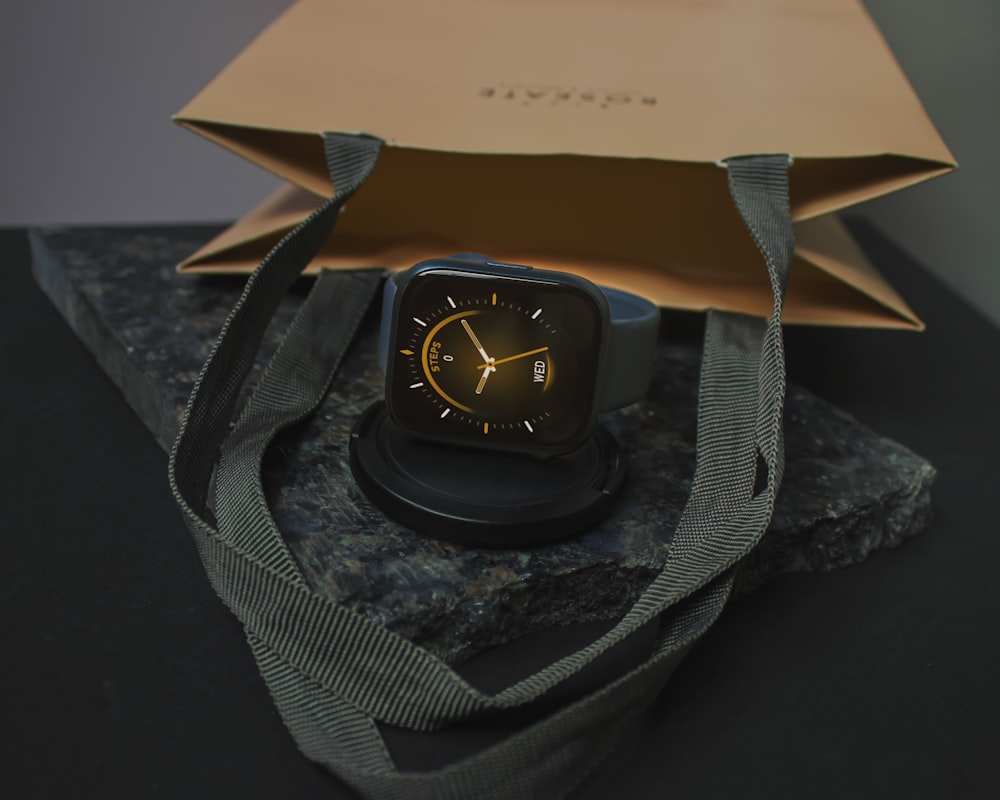 black and gold analog watch