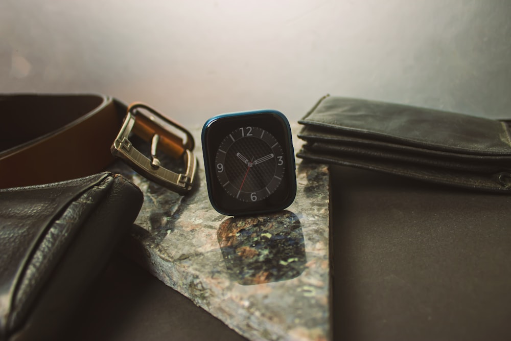 black and silver analog watch