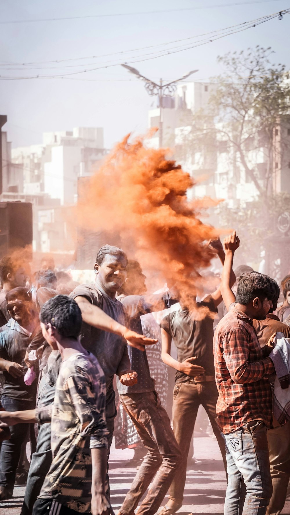 people standing and holding fire