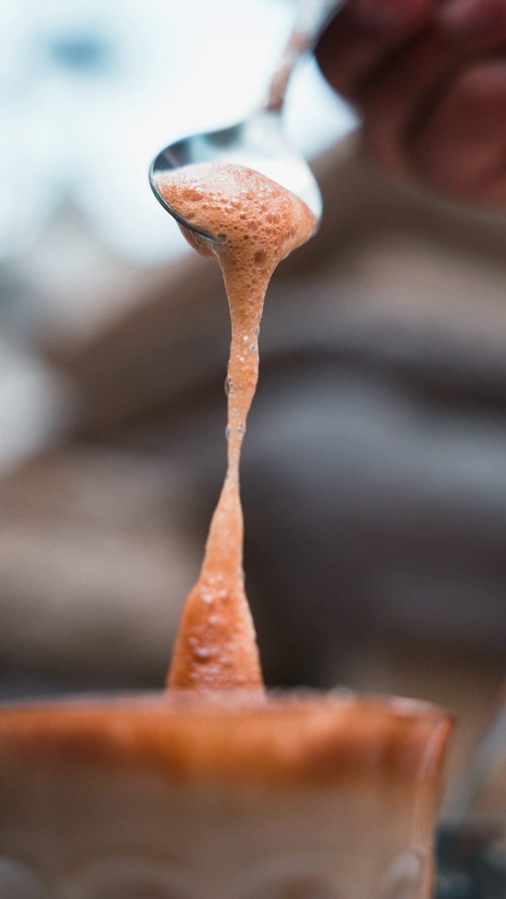 brown and white ice in close up photography