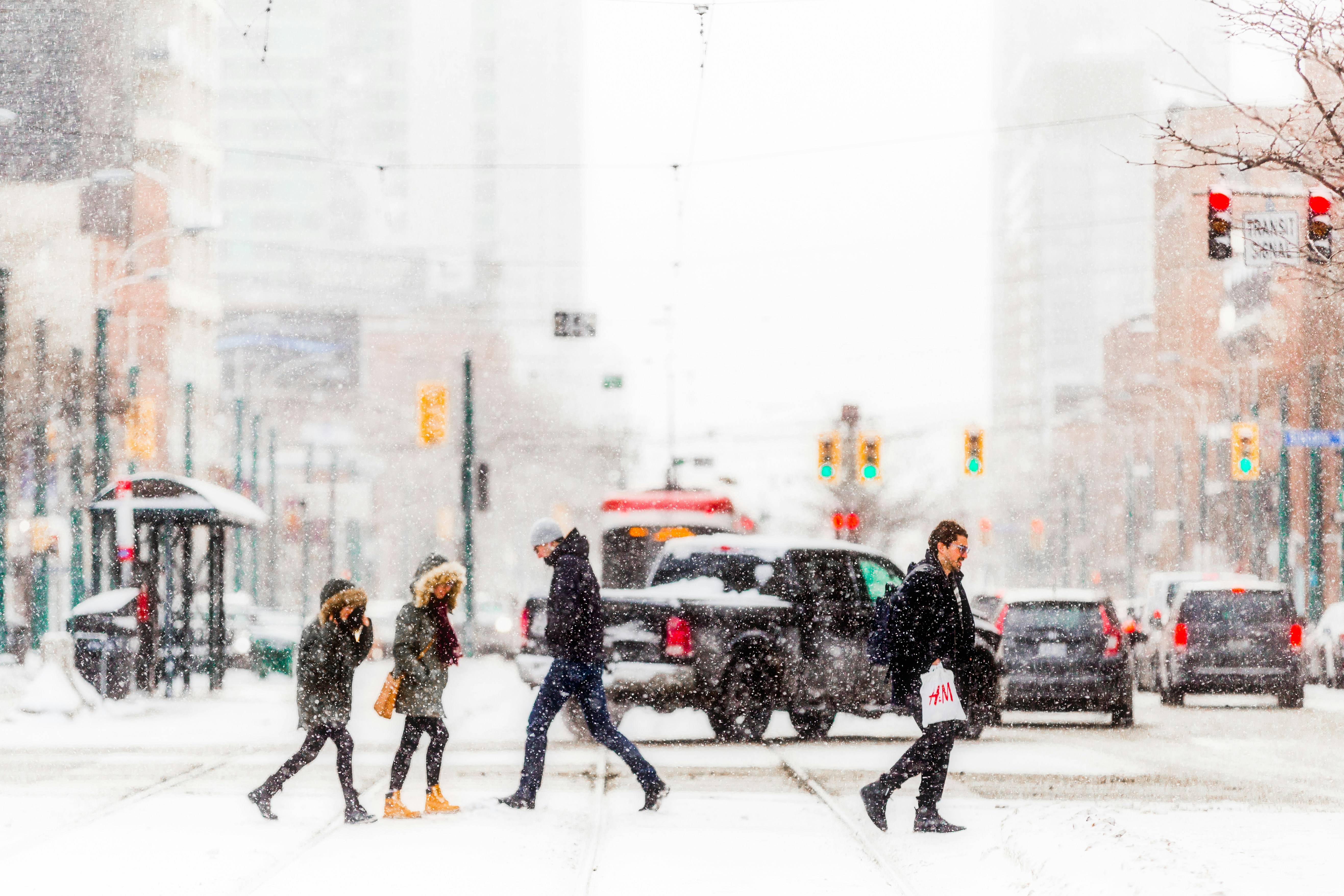 People walking on snow covered road during daytime photo – Free Building  Image on Unsplash