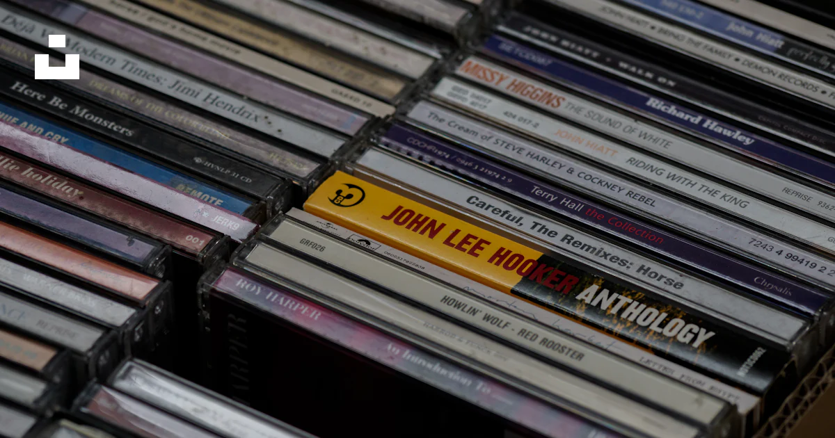 Stack of cd case collection photo – Free Brown Image on Unsplash