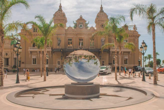 people walking on park near brown concrete building during daytime