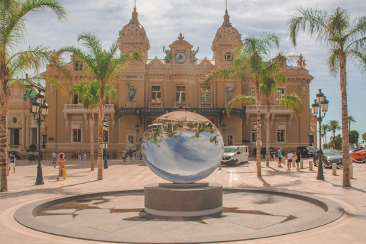 people walking on park near brown concrete building during daytime