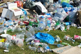 blue plastic bottle on green grass field