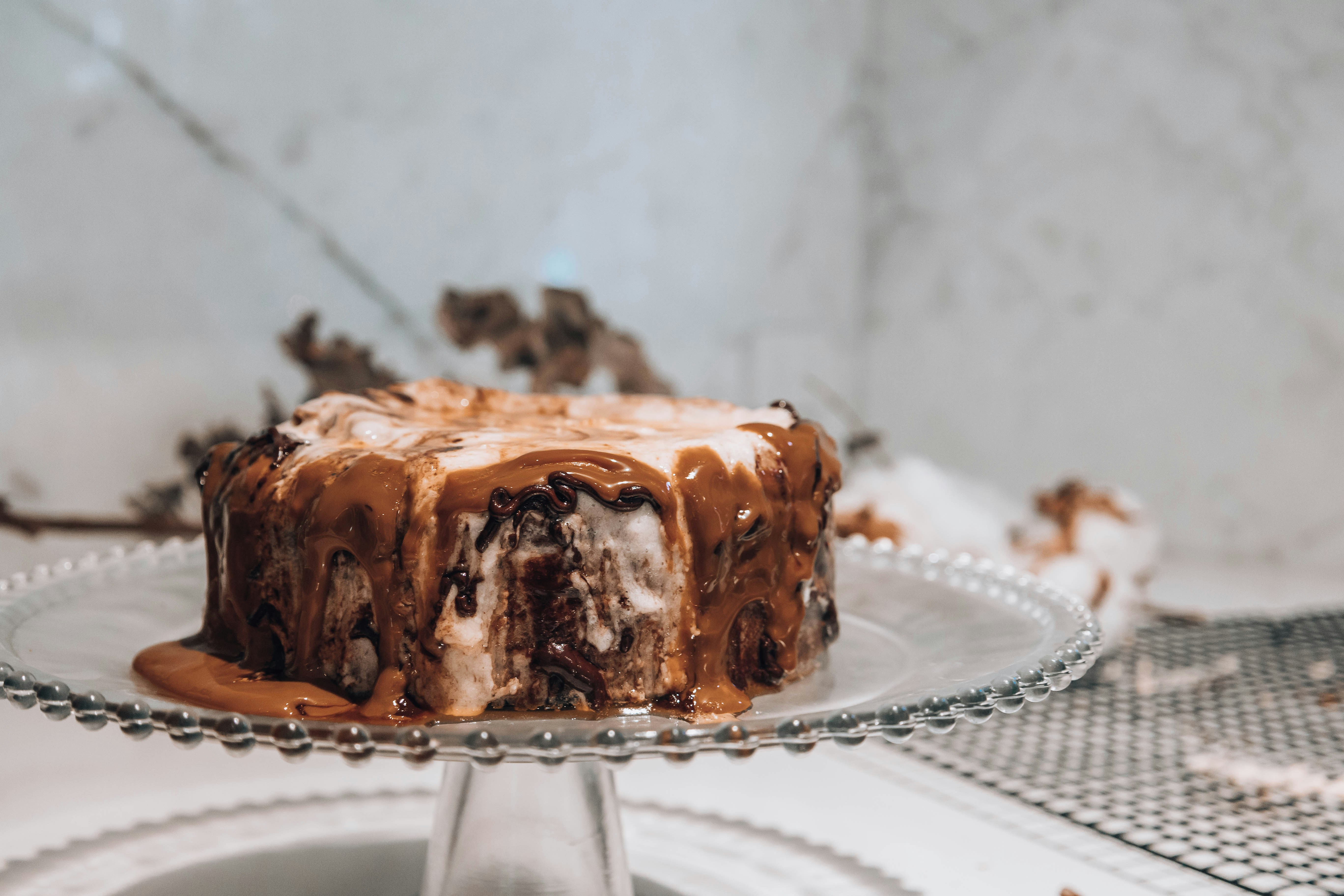 BRAAM CAKES ice cream cake preview, caramel drizzle on layered cake, bright studio background