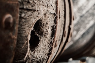 A close-up of a used wine barrel showcasing its texture.