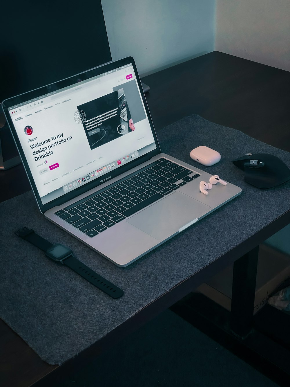 macbook pro on black table