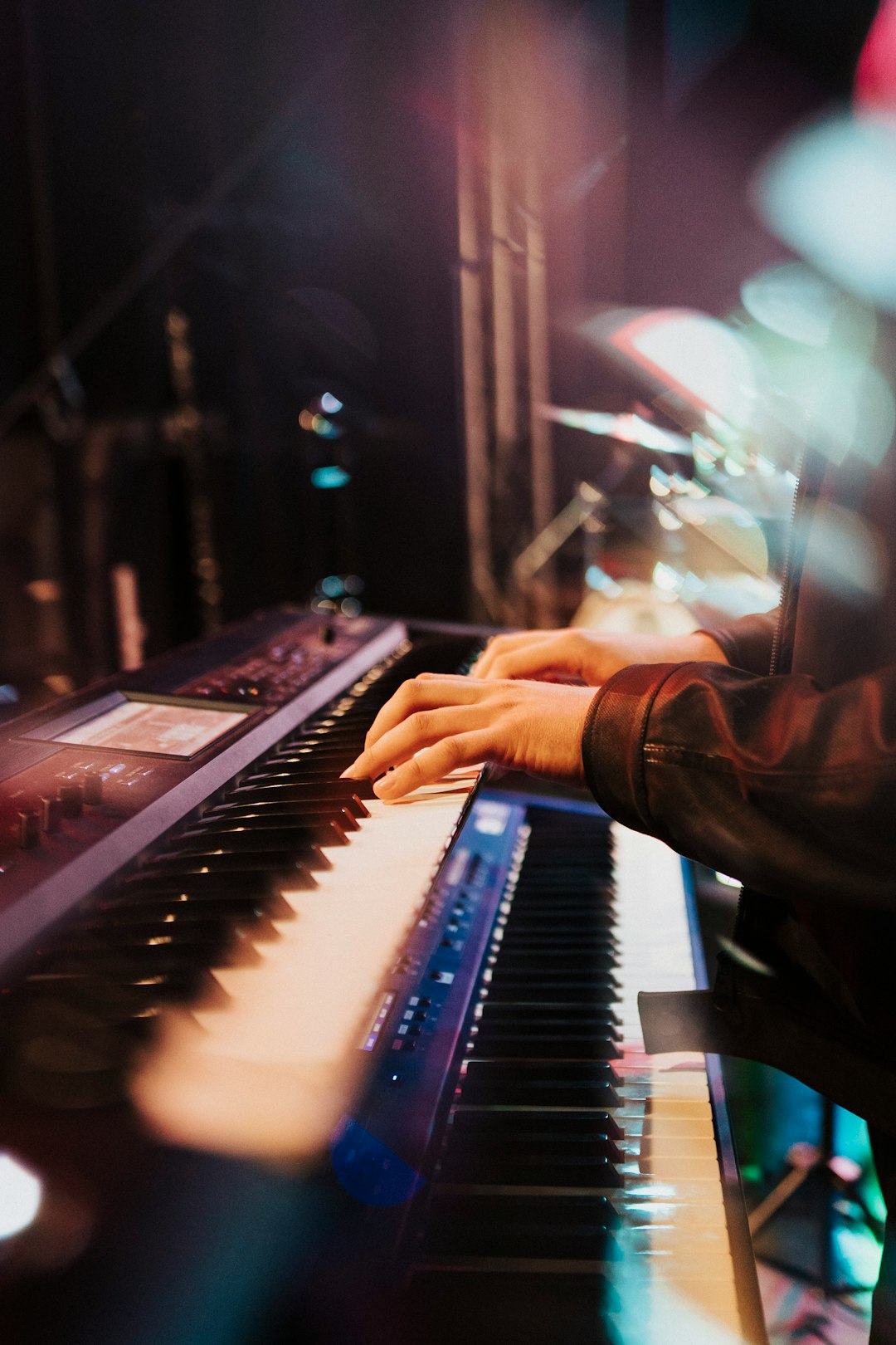 person playing black and white electric piano