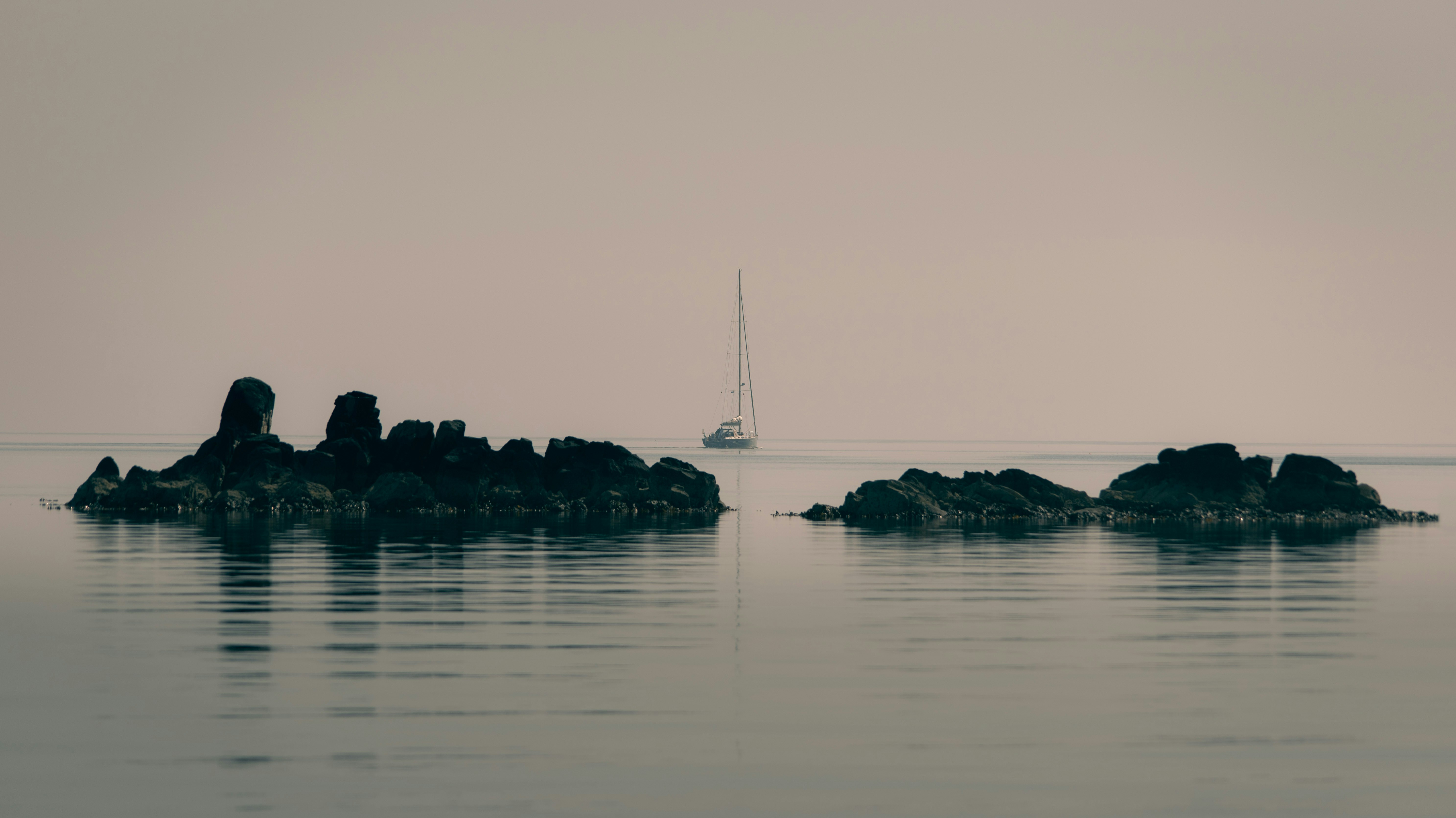 white sailboat on body of water during daytime