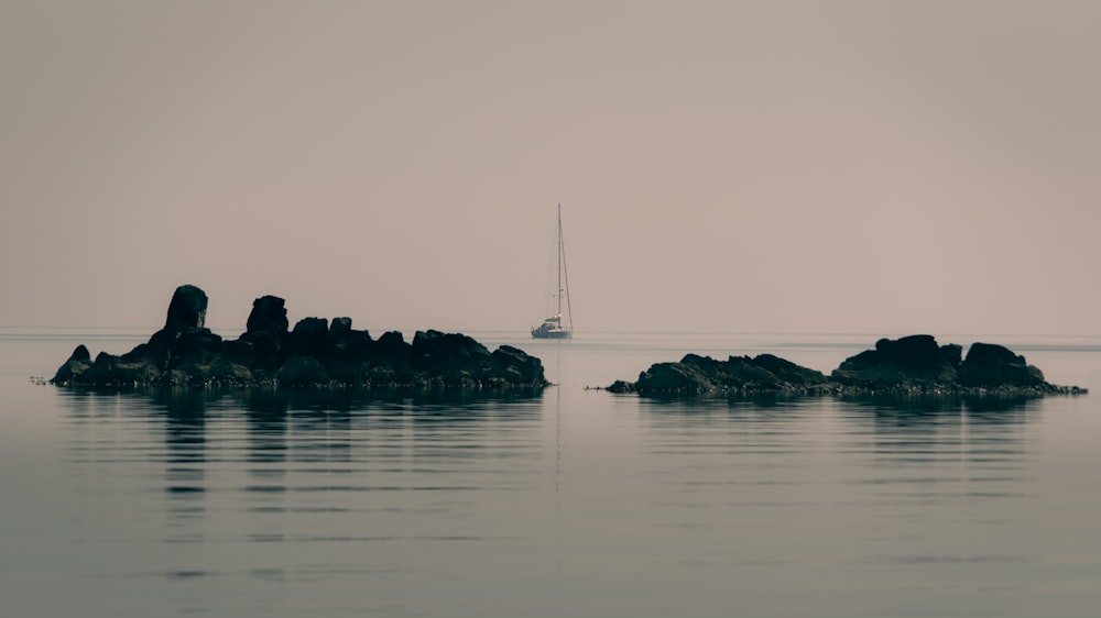 white sailboat on body of water during daytime