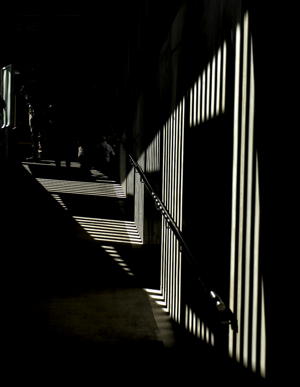 silhouette of person walking on hallway