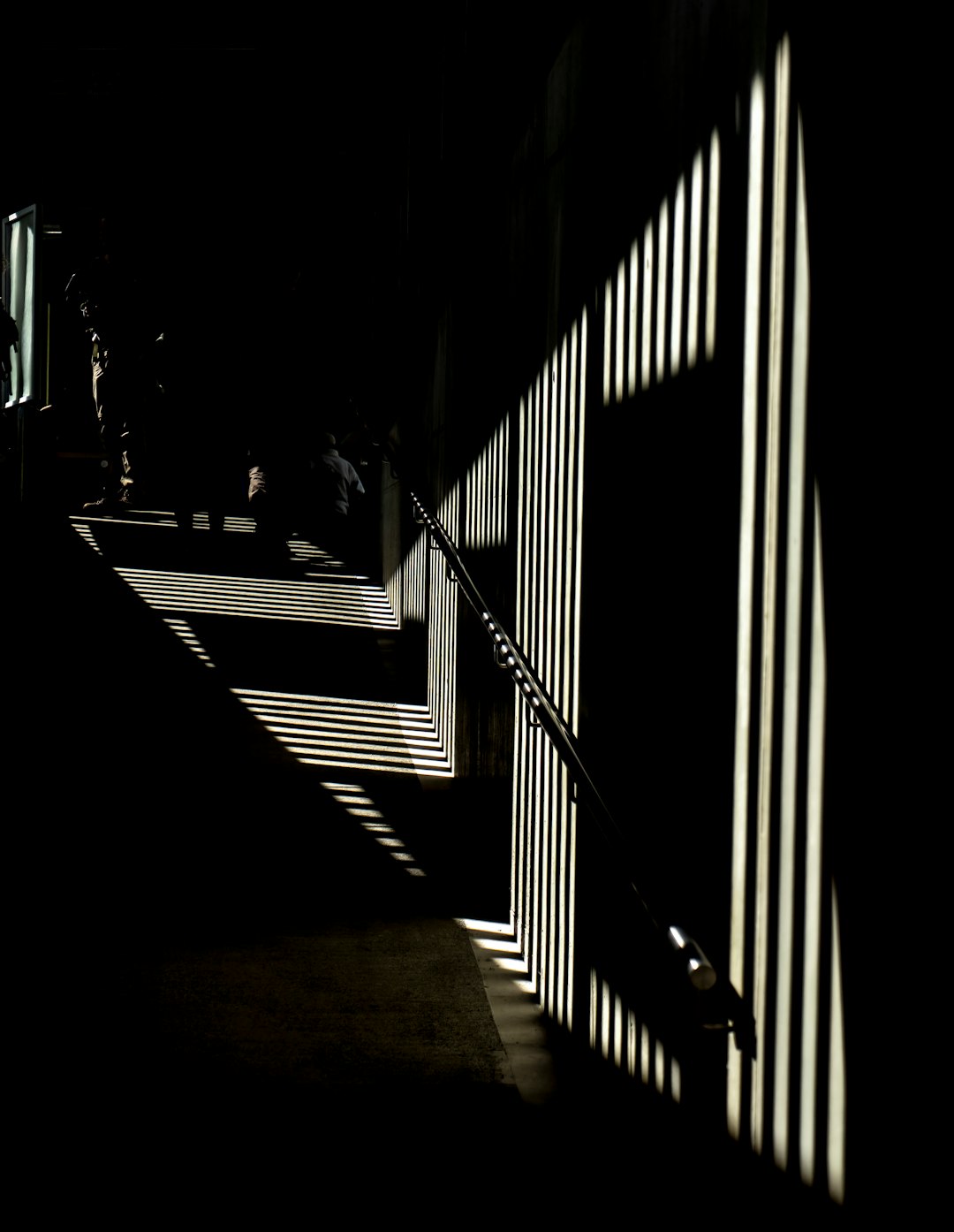 silhouette of person walking on hallway