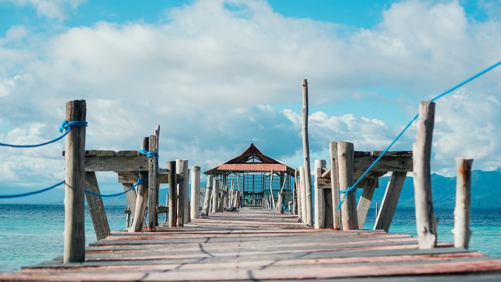 brown wooden dock under blue sky during daytime