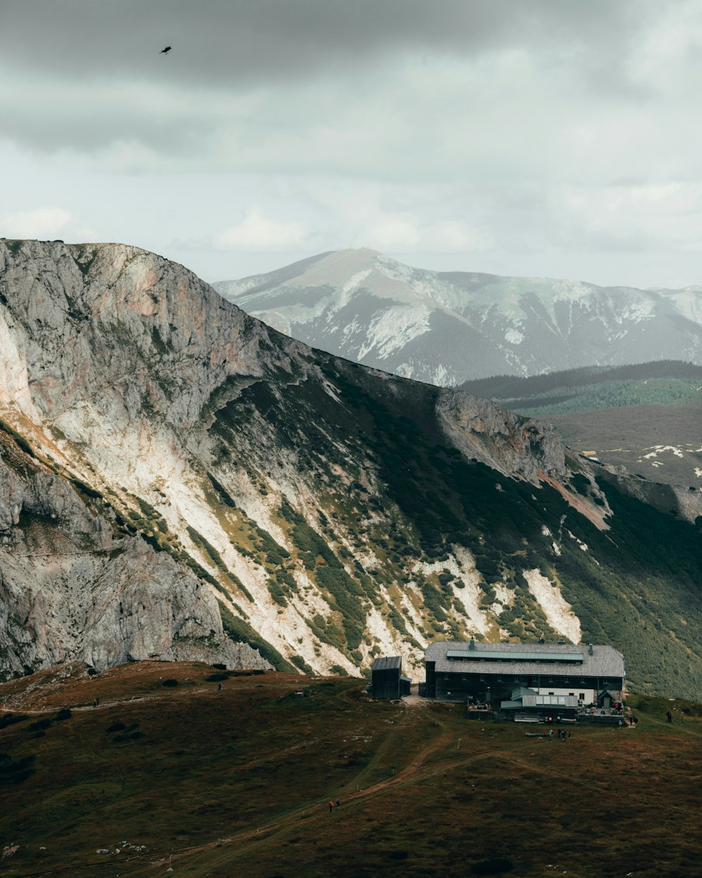 white and black house on top of mountain