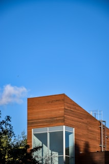 Exterior view of the Presswood Pro factory building under clear sky.