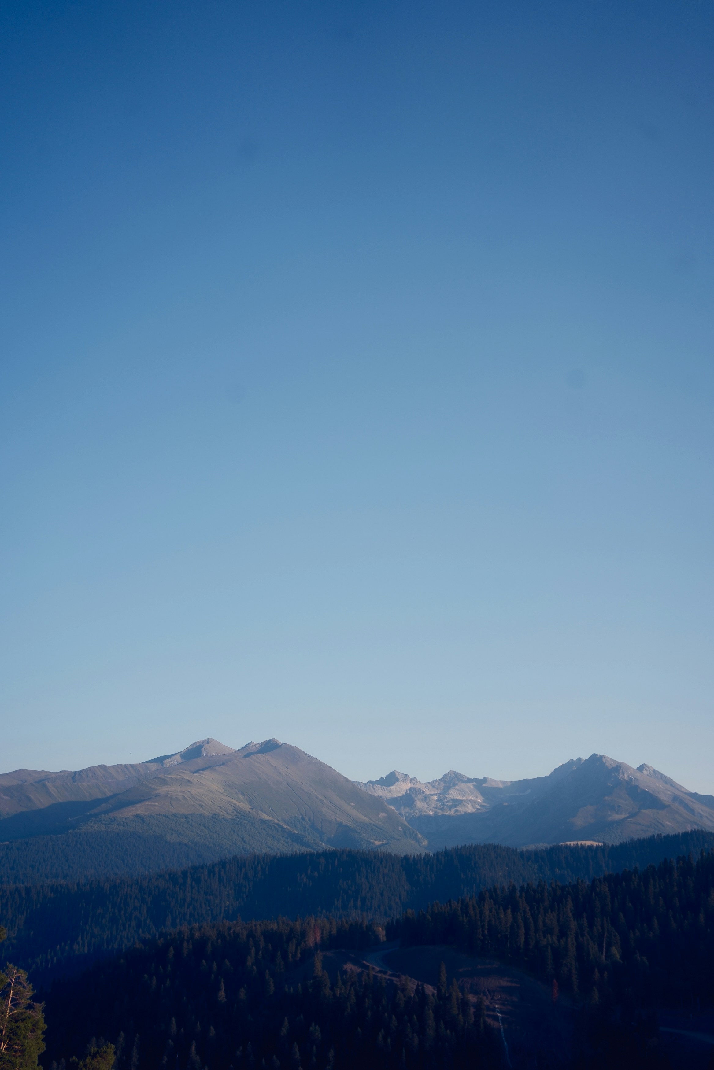 snow covered mountains under blue sky during daytime