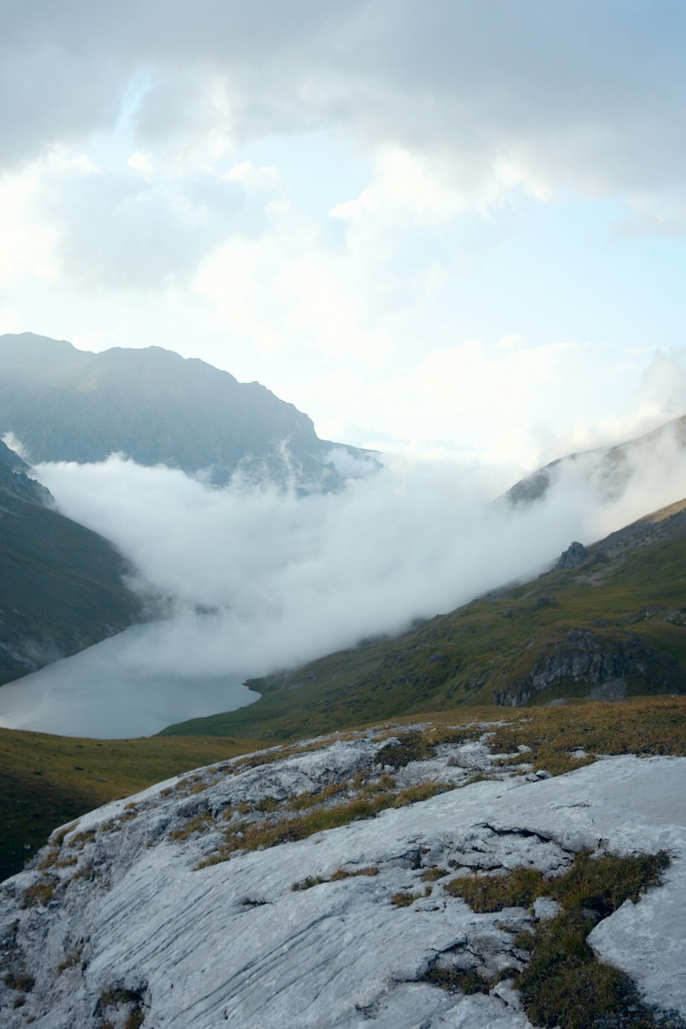 green and brown mountains under white clouds during daytime