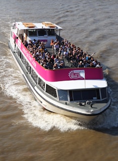 a group of people on a boat in the water