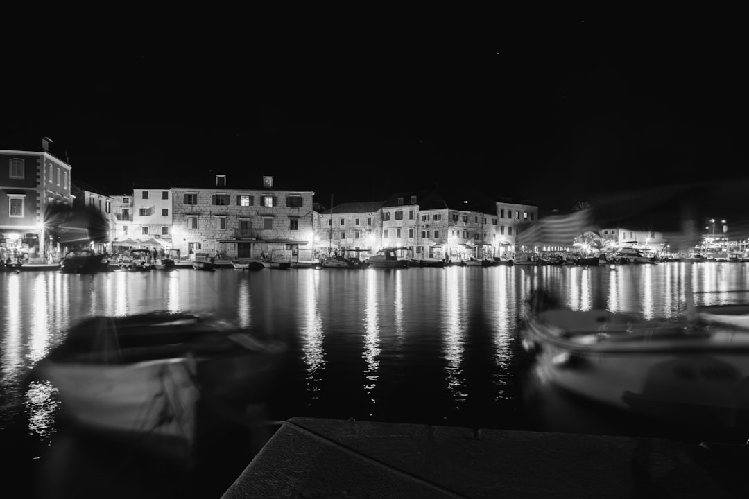 grayscale photo of city skyline during night time