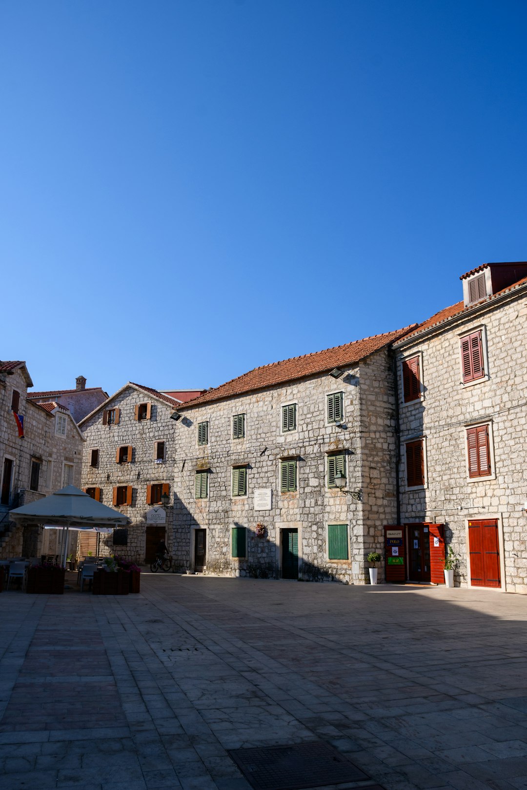 white and brown concrete building under blue sky during daytime