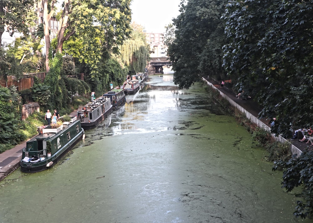 people riding on boat on river during daytime