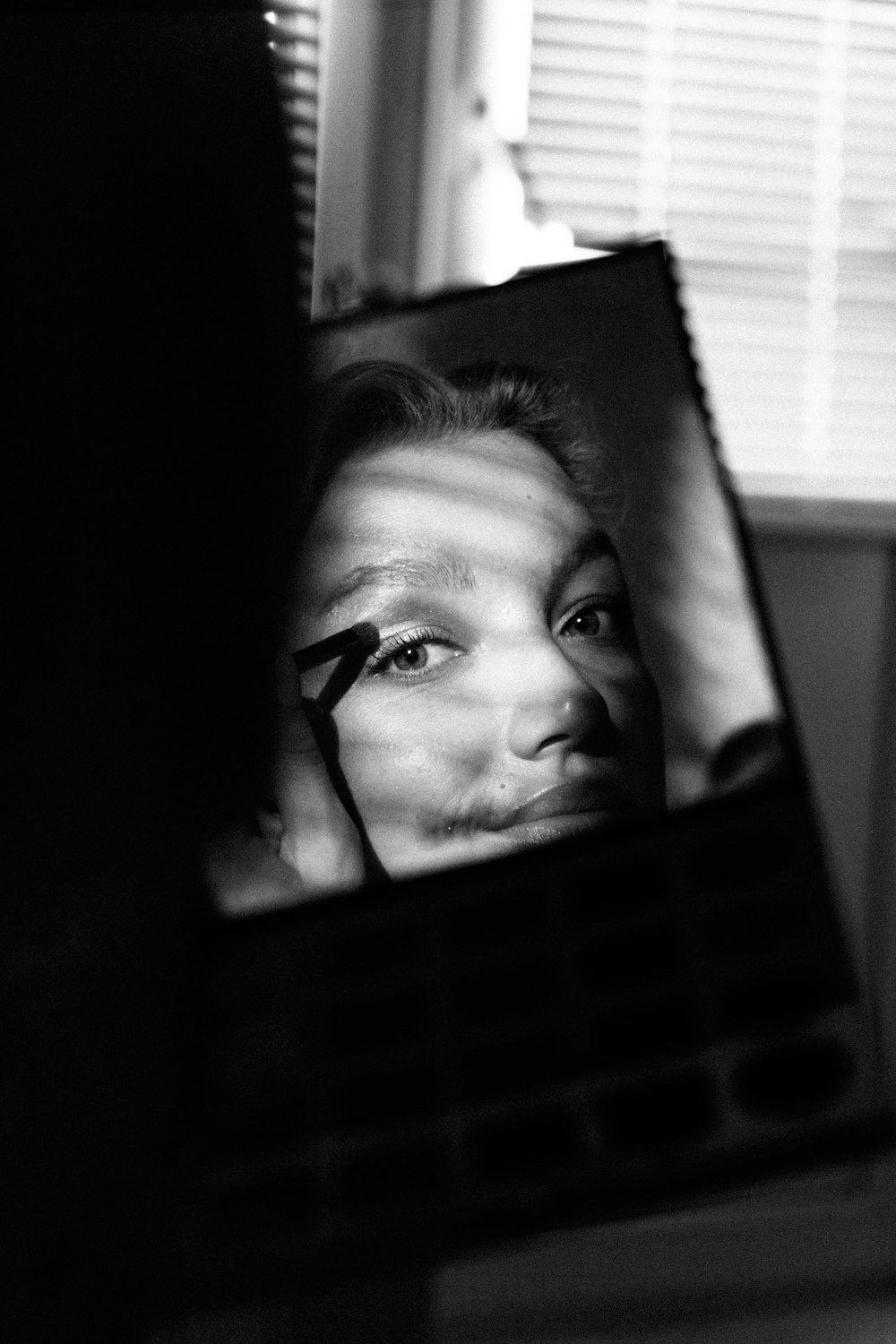 grayscale photo of womans face