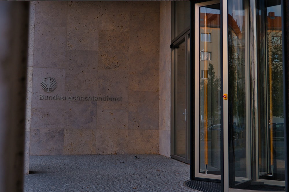 white wooden framed glass door