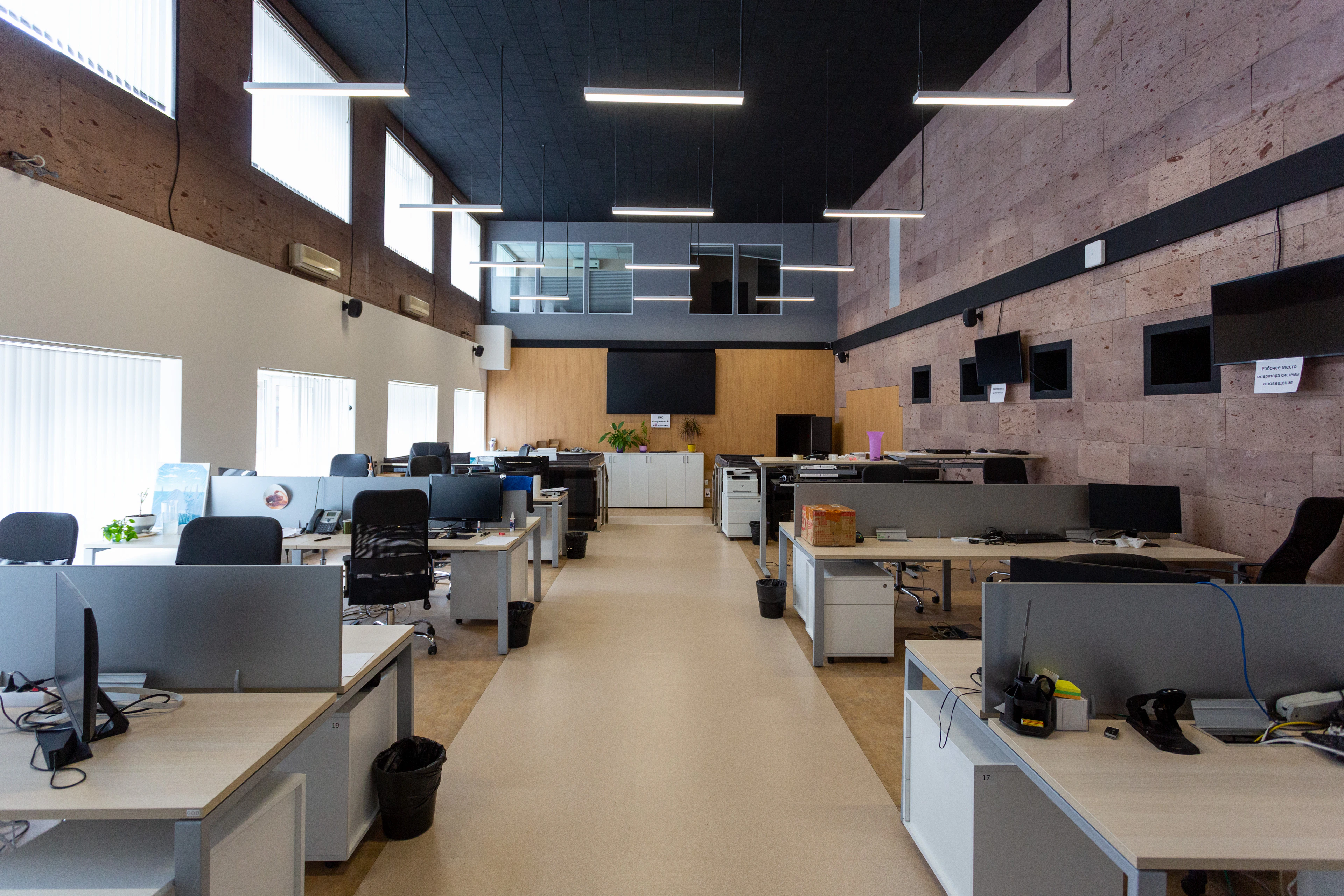 Open-plan agency office with rows of desks