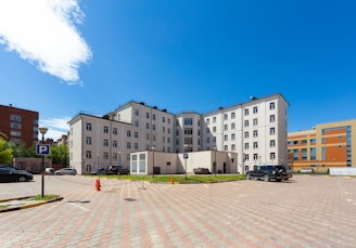 white and gray concrete building under blue sky during daytime