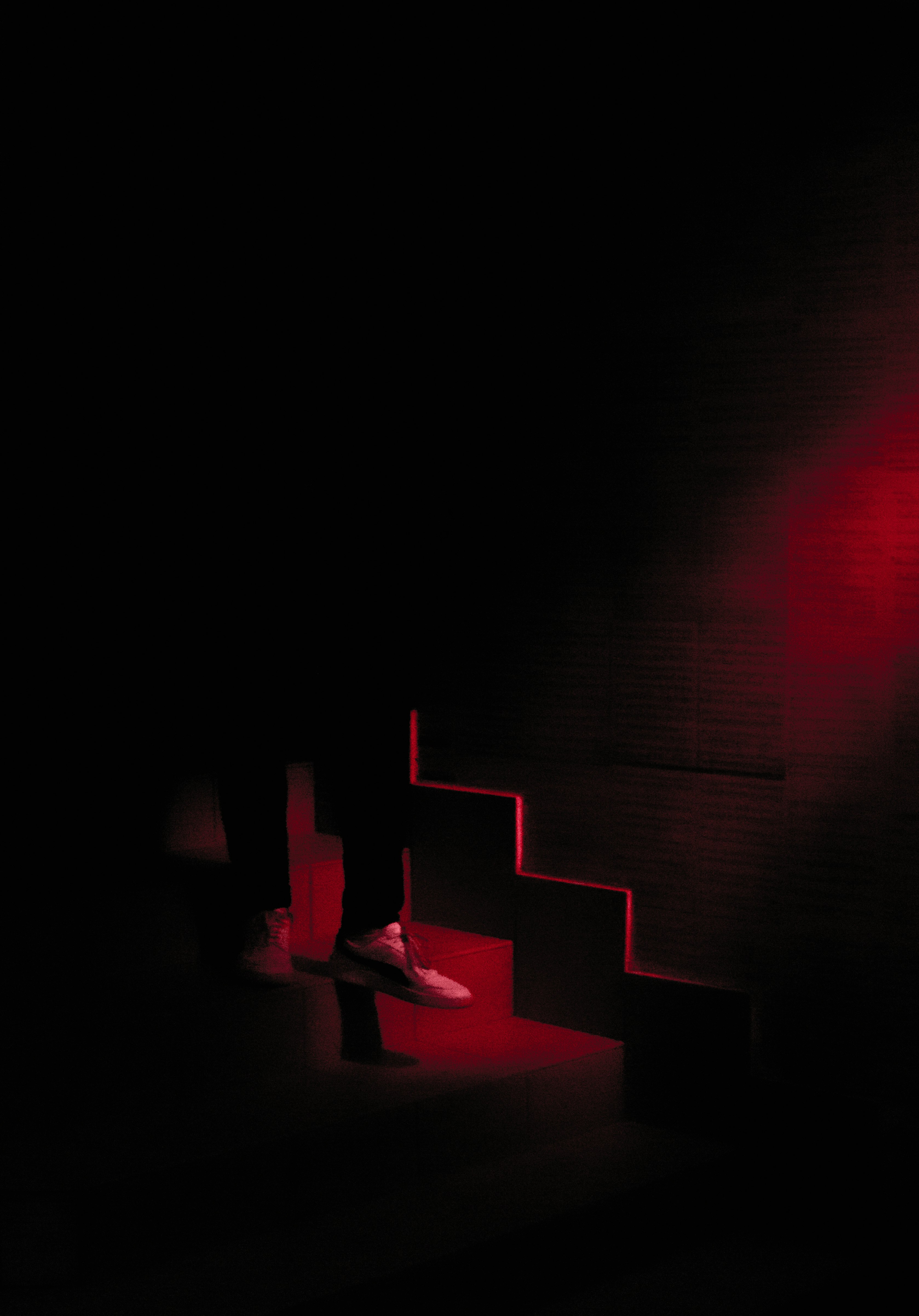 red and black stairs with red lights