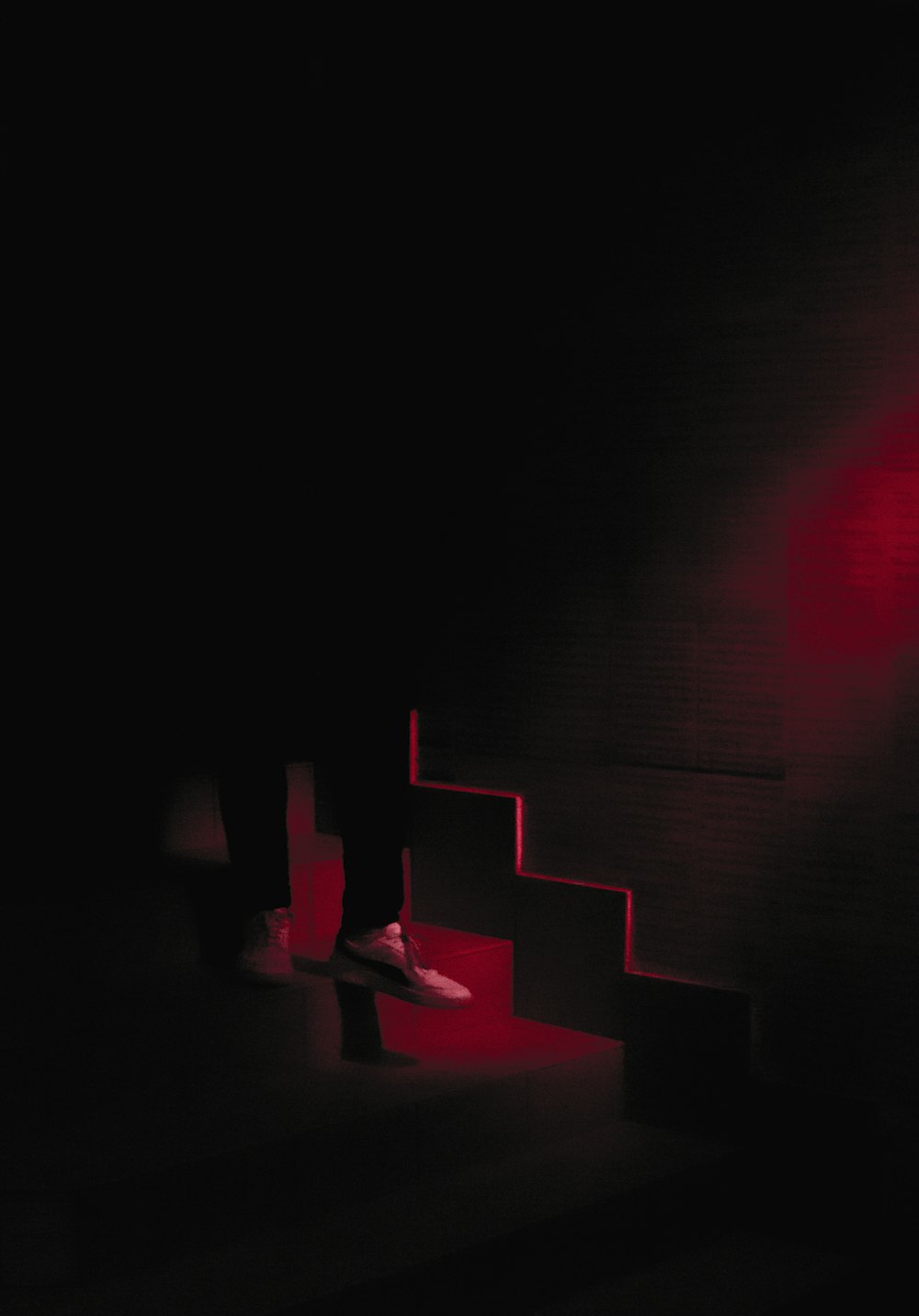 red and black stairs with red lights
