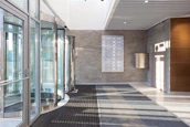 white and brown tiled hallway