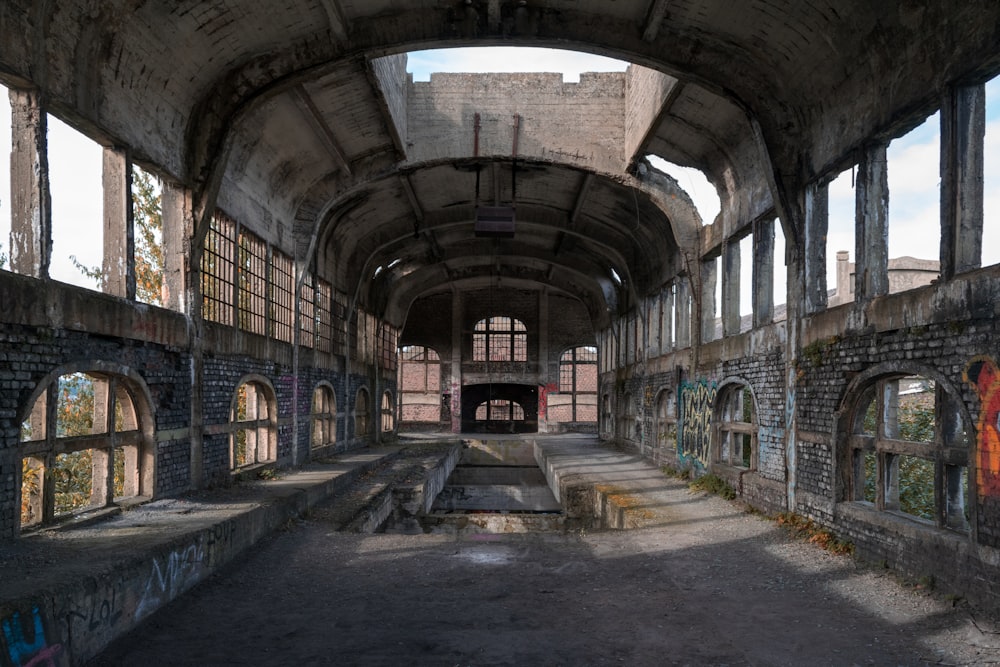 gray concrete tunnel with light turned on during daytime