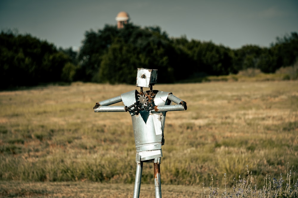 white and gray windmill on brown grass field during daytime